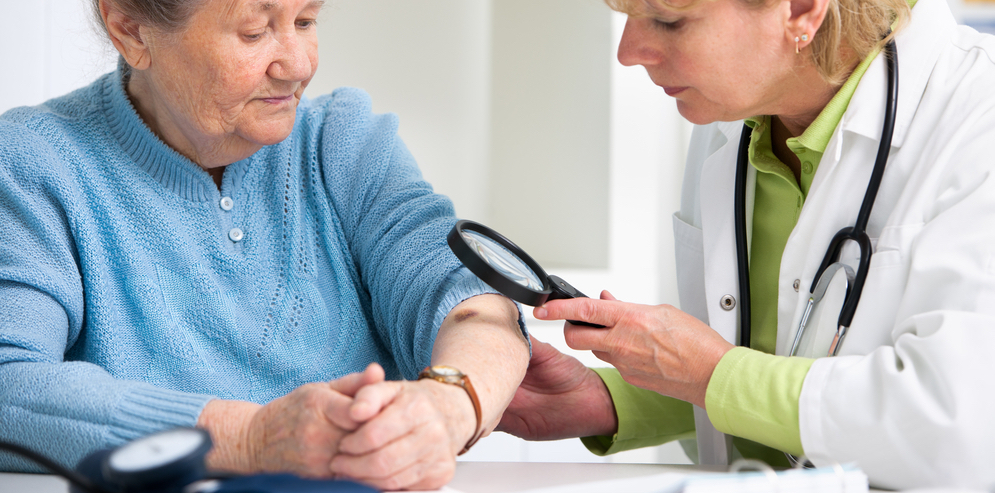 Doctor inspecting a patient's arm