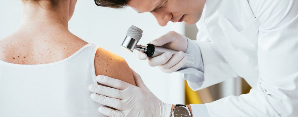 Doctor examining a patient's arm