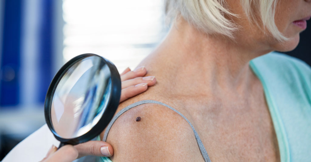 A doctor examining a person's skin