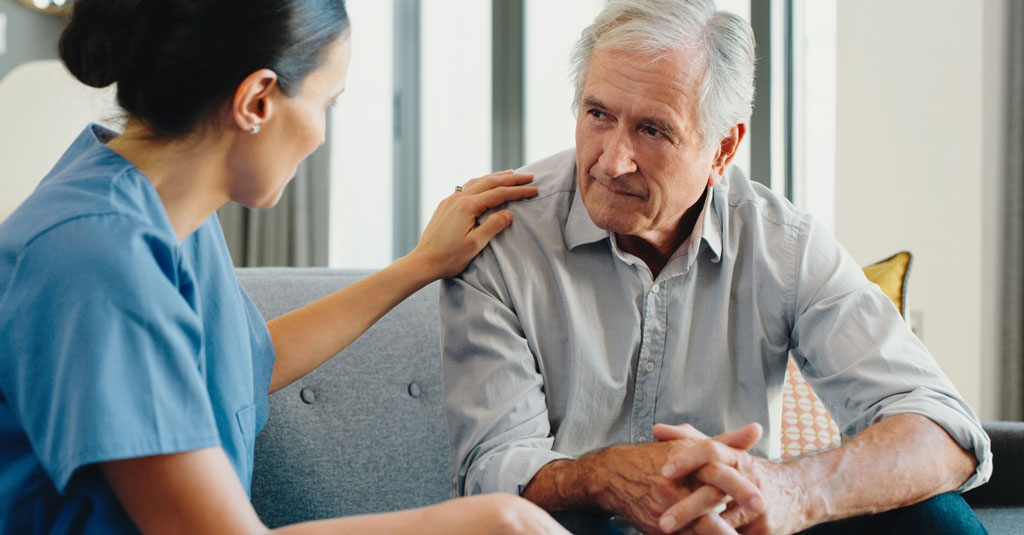 A woman doctor talking to a patient