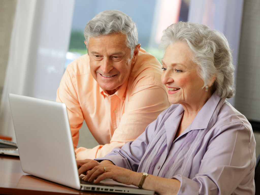 Man and Woman using a Laptop