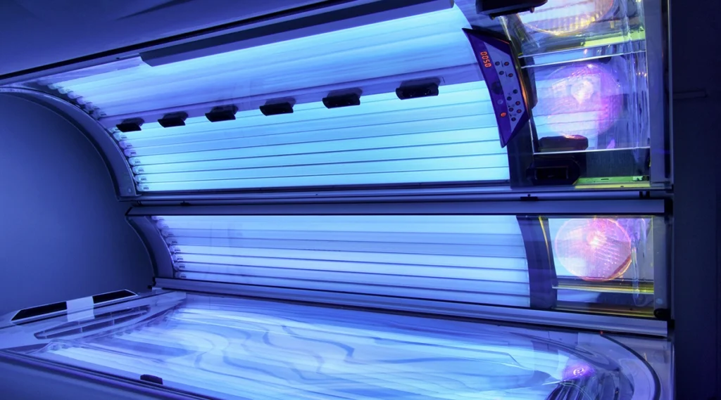 Close up view of a blue light therapy or radiation treatment device used in a clinical setting, illustrating technology commonly associated with non surgical skin cancer treatment options like IGSRT.